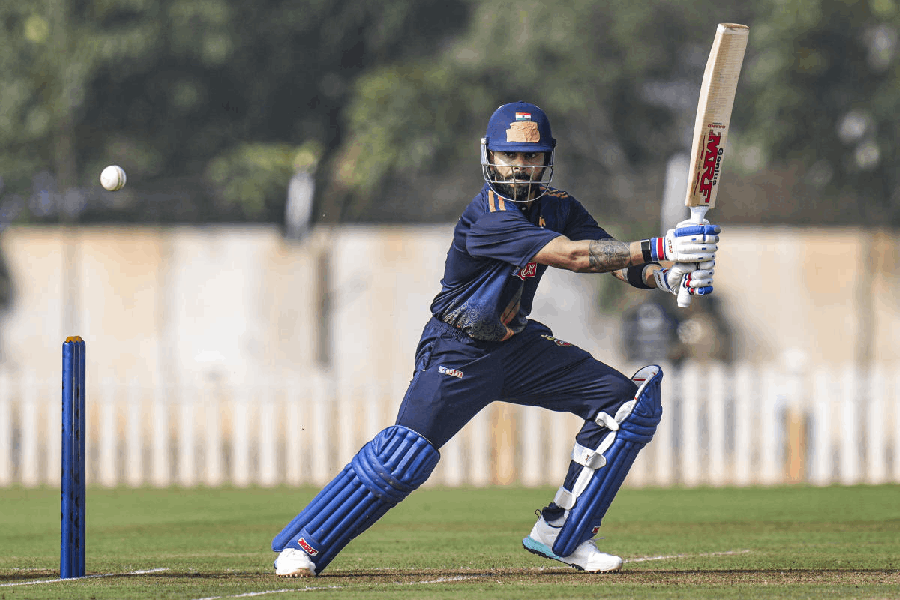 Delhi's Virat Kohli plays a shot during the Vijay Hazare Trophy 2025-26 cricket match between Gujarat and Delhi, at BCCI Centre of Excellence Ground, in Bengaluru, Friday, Dec. 26, 2025.