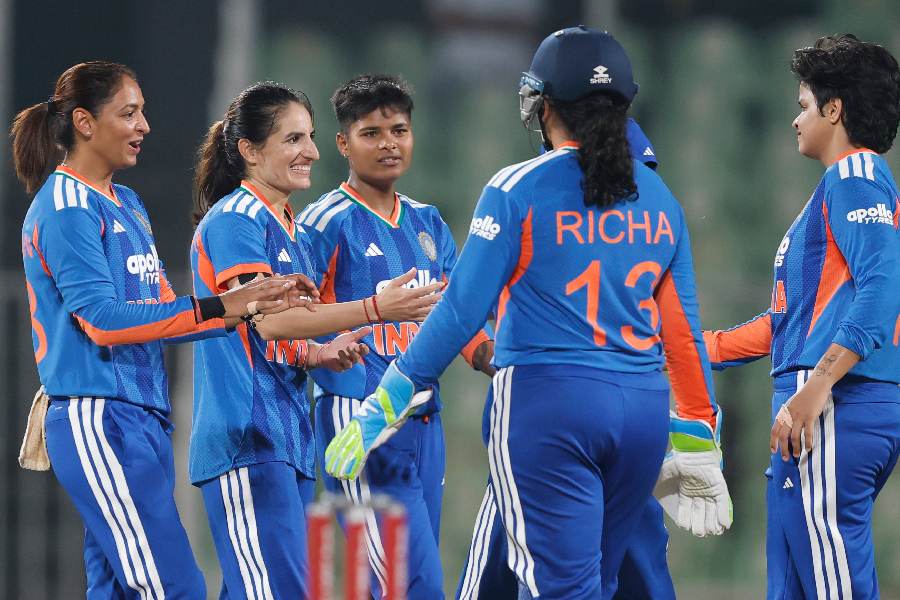Renuka Singh Thakur celebrates with her teammates after taking wickets in Trivandrum against Sri Lanka on 26 December, 2025.