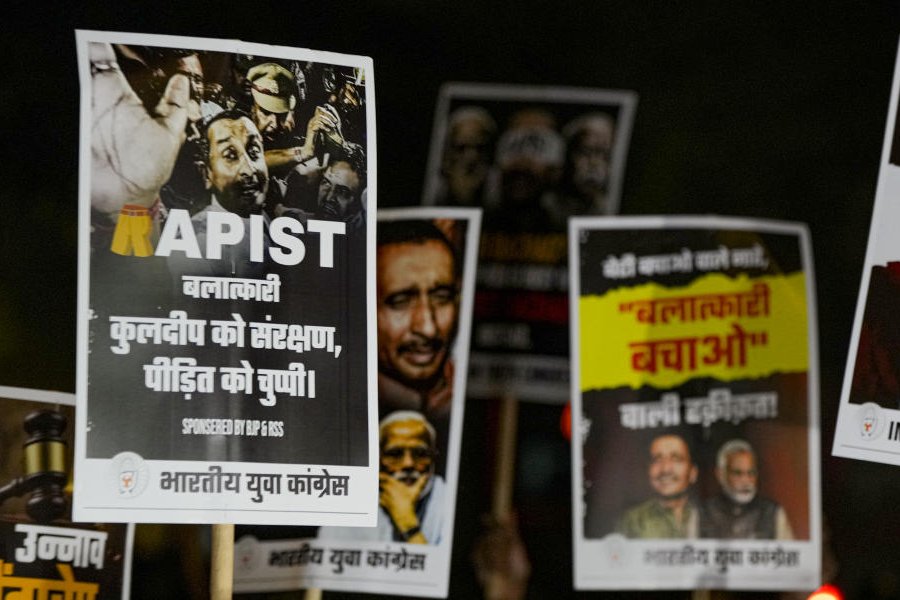 Members of the Indian Youth Congress participate in a candle march seeking justice for the Unnao rape case, in New Delhi, Friday, Dec. 26, 2025.