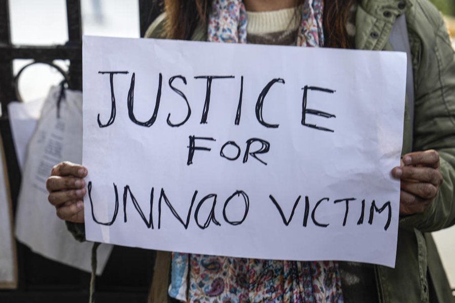 A protester raises slogans during a demonstration against the suspension of the jail term of Kuldeep Sengar, a former BJP MLA who was convicted in the Unnao rape case