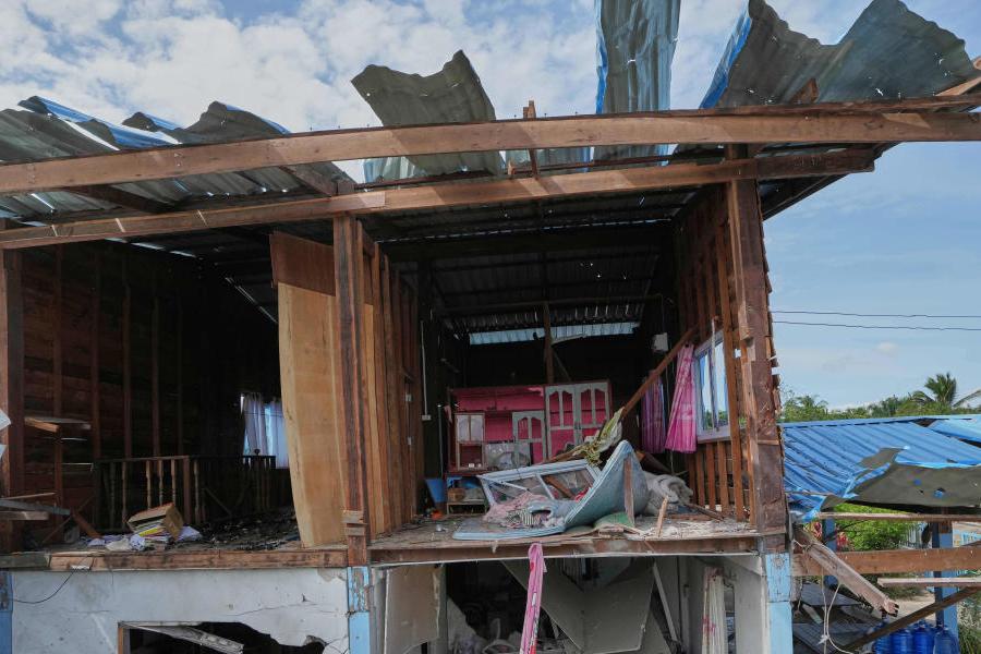 A house is seen damaged following a Thai soldier said was a Cambodian artillery strike in Sisaket province, Thailand, Sunday, Dec. 14, 2025.
