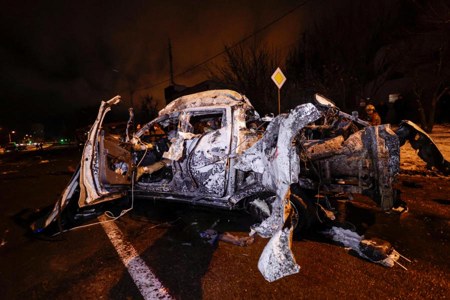 The body of a person killed lies inside a car destroyed during an evening Russian air strike, amid Russia's attack on Ukraine, in Kharkiv, Ukraine, December 26, 2025.
