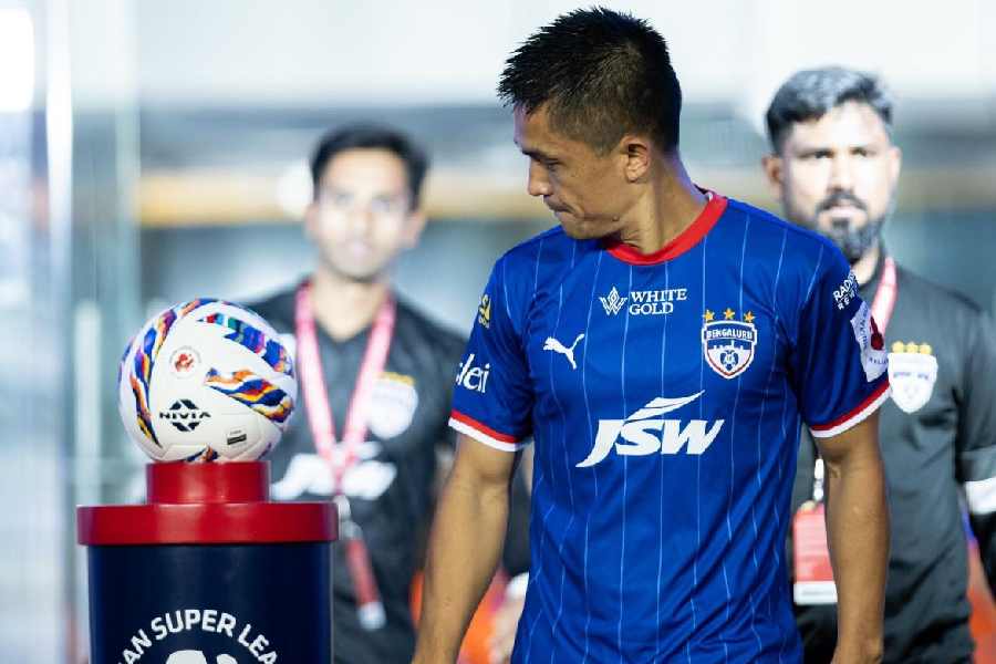 Bengaluru FC star Sunil Chhetri looks at the match-ball before an ISL match. 