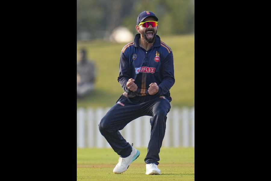 Virat Kohli celebrates the fall of a wicket during Delhi’s Vijay Hazare Trophy match against Gujarat at the BCCI Centre of Excellence Ground in Bengaluru on Friday.