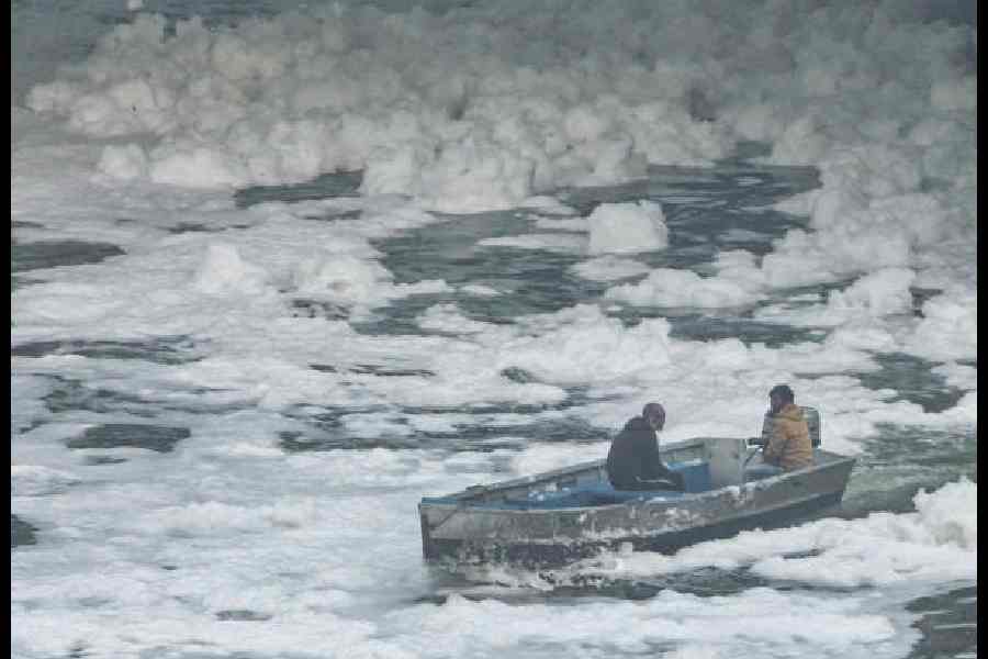 A boat moves through a polluted stretch of the Yamuna in New Delhi last month.