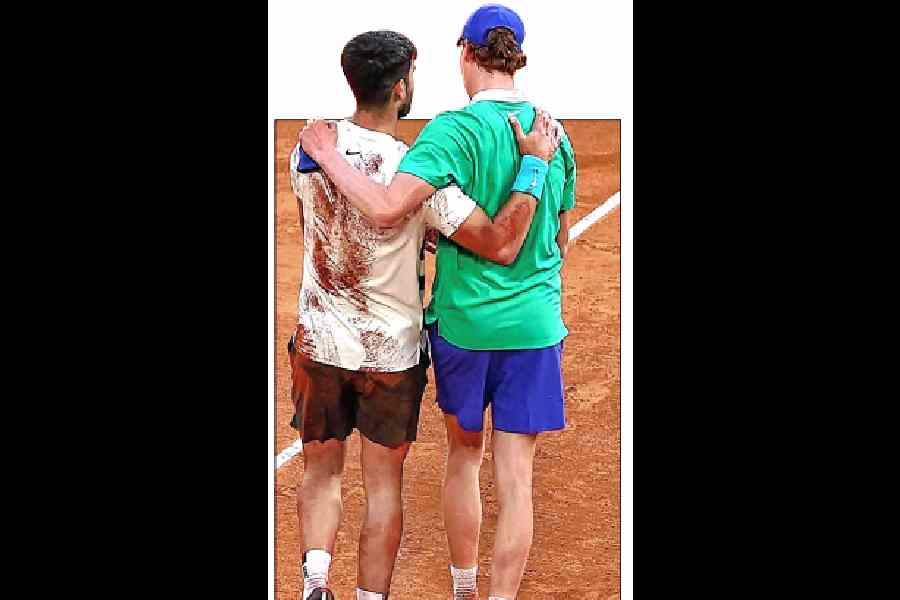 Carlos Alcaraz and (right) Jannik Sinner, in an enduring image from the French Open men’s final in June this year, after the Spaniard pulled off a thrilling comeback in 5 hours and 29 minutes to lift the title at Roland Garros.