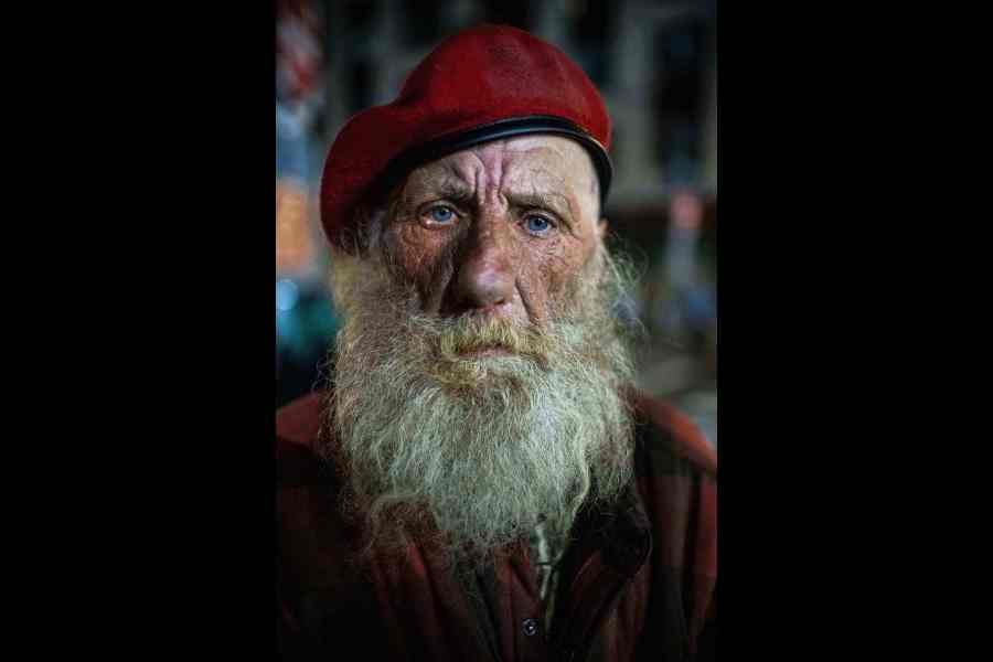 Eugene Graham watches as protesters stand off against police at a US Immigration and Customs Enforcement facility in Portland, Oregon, on October 5.