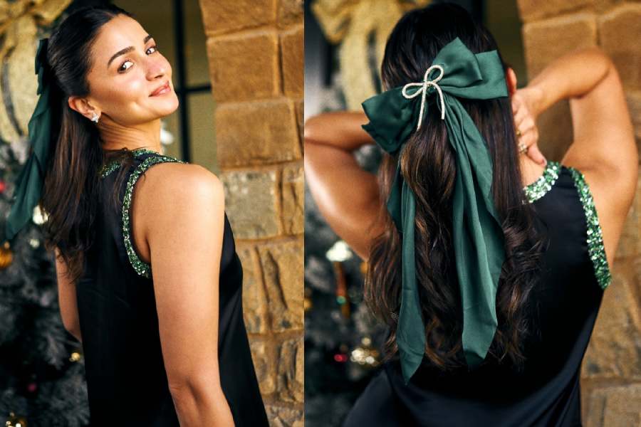 Alia Bhatt flaunts a green bow. 