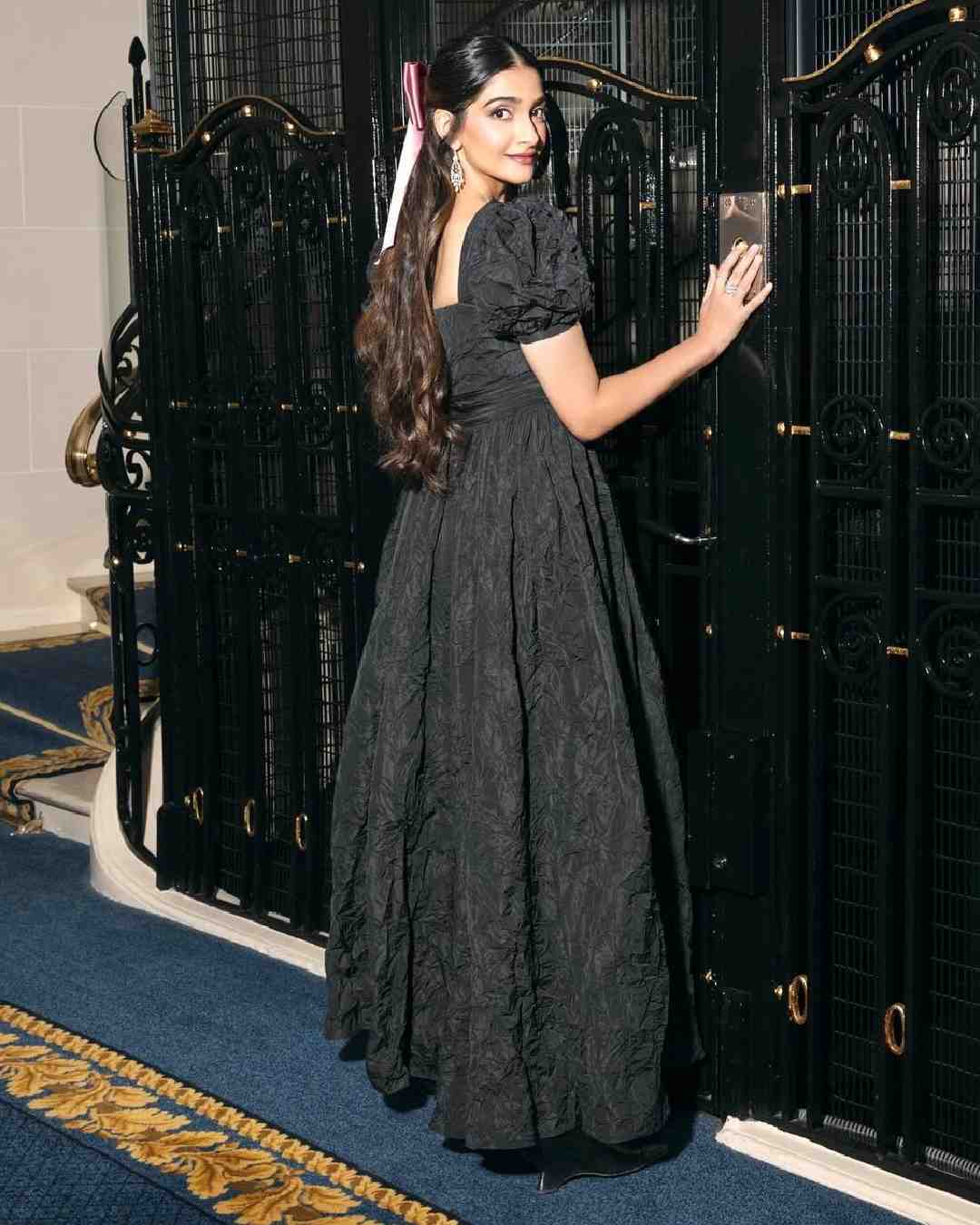 Sonam Kapoor opted for a blush pink satin bow. 