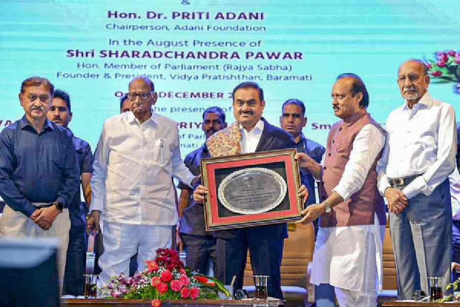Sharad Pawar and Ajit Pawar with Gautam Adani at the inauguration of the Vidya Pratishthan Sharadchandra Pawar Centre of Excellence in AI in Baramati on Sunday.