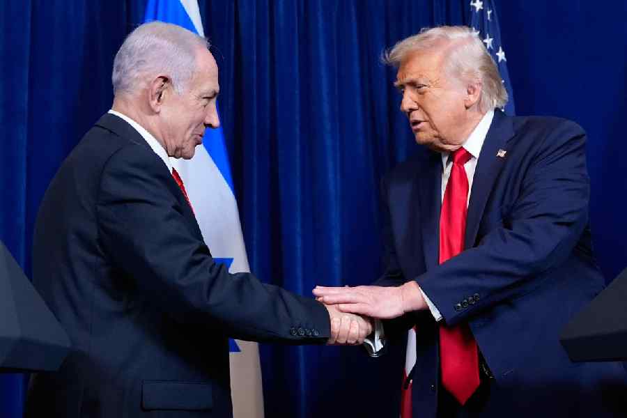 President Donald Trump shakes hands with Israel's Prime Minister Benjamin Netanyahu during a news conference at Mar-a-Lago, Monday, Dec. 29, 2025, in Palm Beach, Fla.