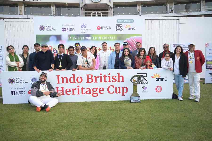 Players of the ‘UK in India’ and their families after winning the Indo-British Heritage Cup 2025 at Eden Gardens on Sunday.