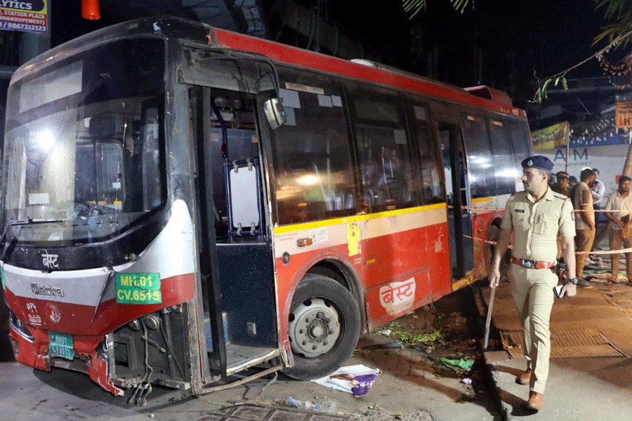 Police personnel at the site after a Brihanmumbai Electric Supply and Transport (BEST) bus accident, wherein encroachment of the sidewalk by hawkers forced pedestrians to step onto the road, leading to the death of four people, near Bhandup railway station in Mumbai, Monday night, Dec. 29, 2025.