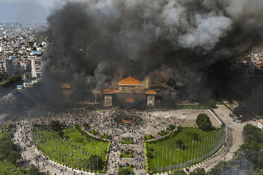 An aerial view of smoke rising from the Federal Parliament of Nepal premises after it was set on fire by protestors during massive anti-government protests, in Kathmandu, Nepal, Tuesday, Sept. 9, 2025.