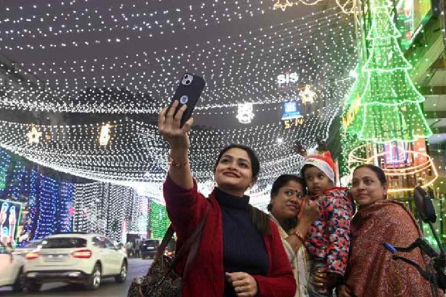 Picture time for a family beneath the canopy of lights on Park Street last week. Picture by Sanat Kr Sinha