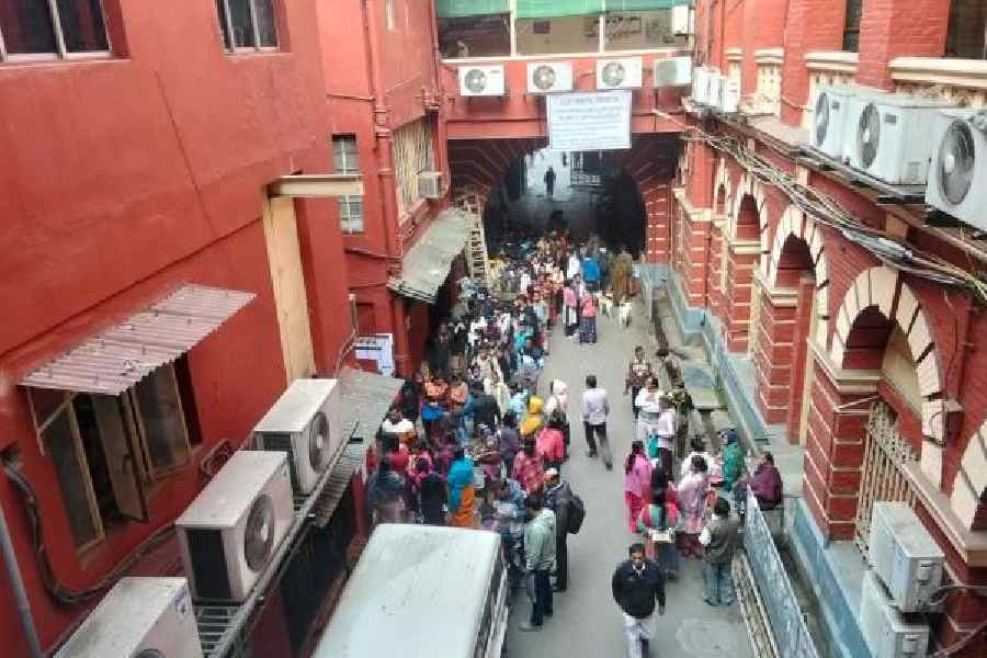 Residents queue up outside the counter to apply for certificates at the KMC headquarters on Tuesday