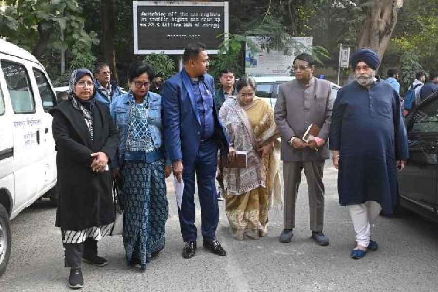 Members of the West Bengal Minority Commission at Jadavpur University on Tuesday; (right) the team with vice-chancellor Chiranjib Bhattacharjee. Pictures by Sanat Kr Sinha