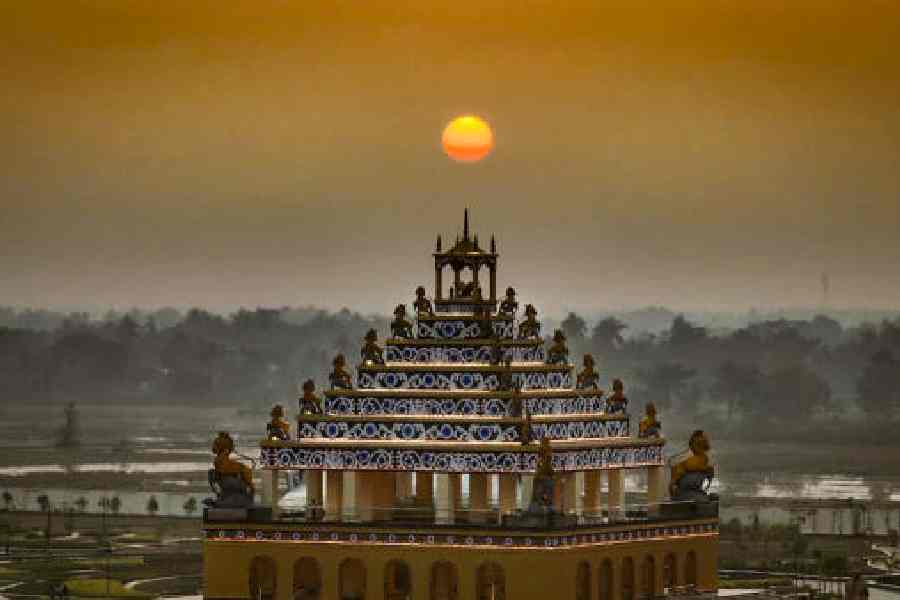 The Batadrava Than temple silhouetted against the setting sun in Nagaon, Assam. 