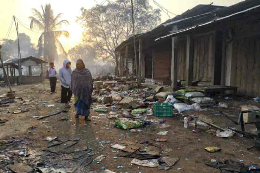 Residents take stock of a vandalised area at Kheroni in Assam's Karbi Anglong district on December 24.