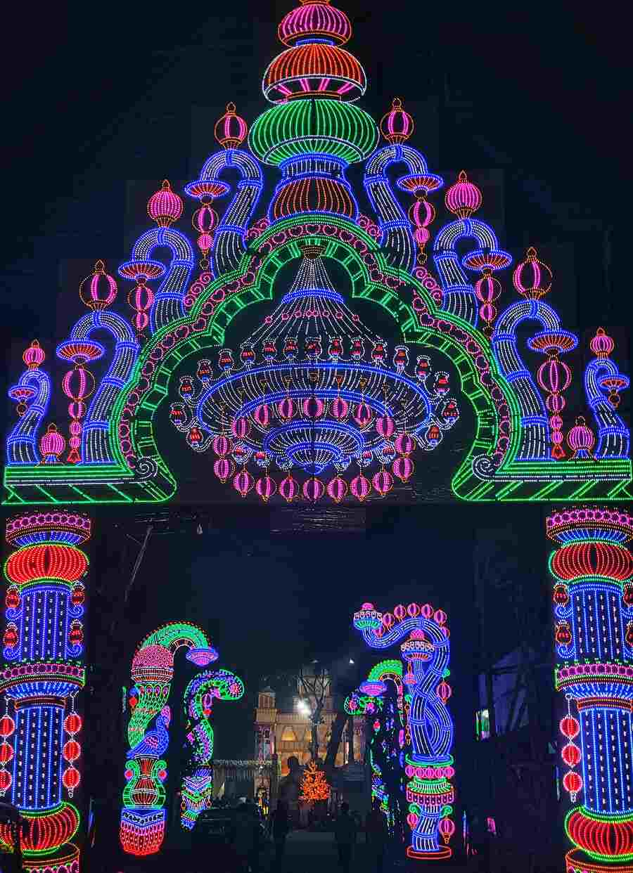 An illuminated gate installed for Saraswati Puja at a club in Salt Lake  