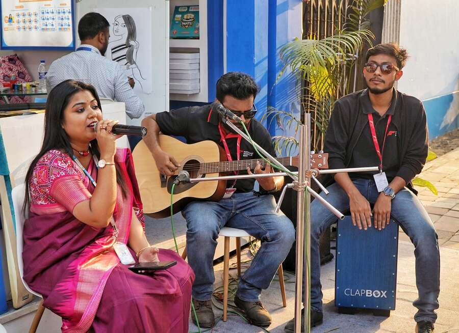 Adding a percussion, musicians set the mood at the fair accompanied by strings and vocals