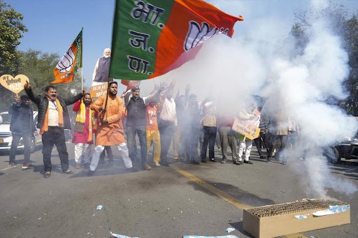 BJP supporters celebrate the party's lead in Delhi Assembly polls in New Delhi, Saturday, Feb. 8, 2025