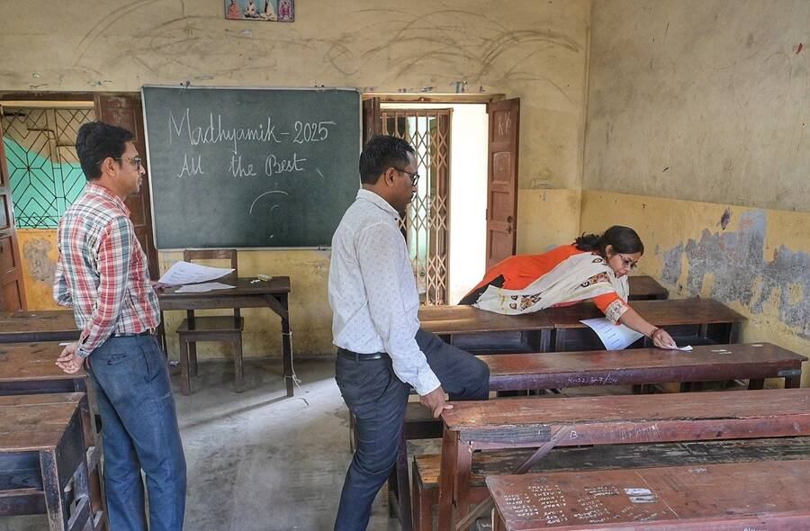 Staff at Taki Boys’ School paste roll numbers of Madhyamik (secondary board exam) examinees. Madhyamik 2025 begins on February 10, Monday, with First Language papers and will continue till February 22, Saturday