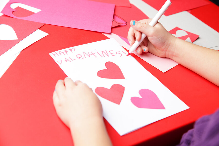 Kid making Valentine's card