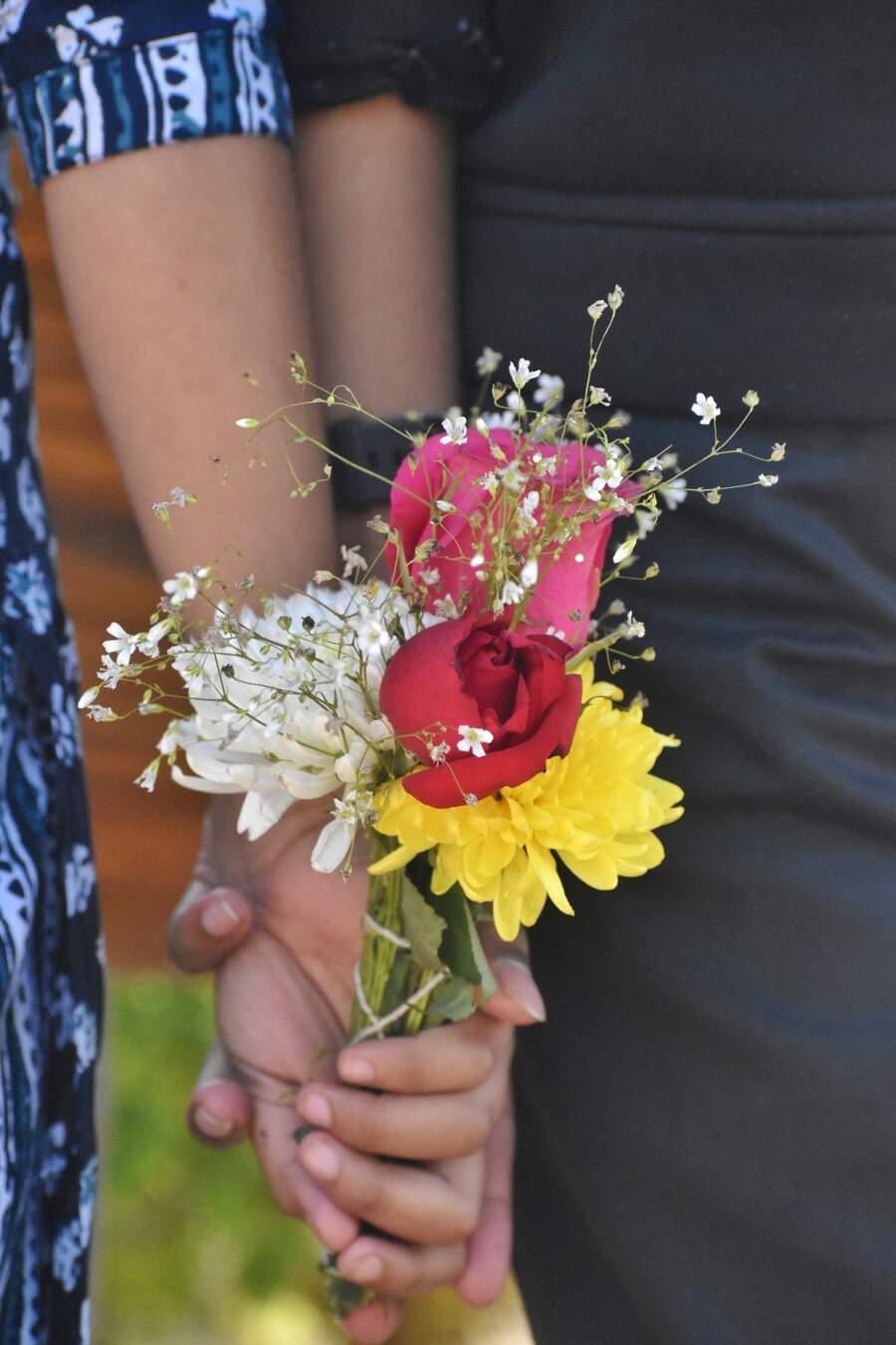Youngsters exchange flowers and walk hand-in-hand spending time together on Valentine’s Day  