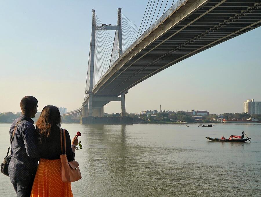 A couple celebrates Valentine’s Day at Prinsep Ghat, watching the sunset over Hooghly, on February  