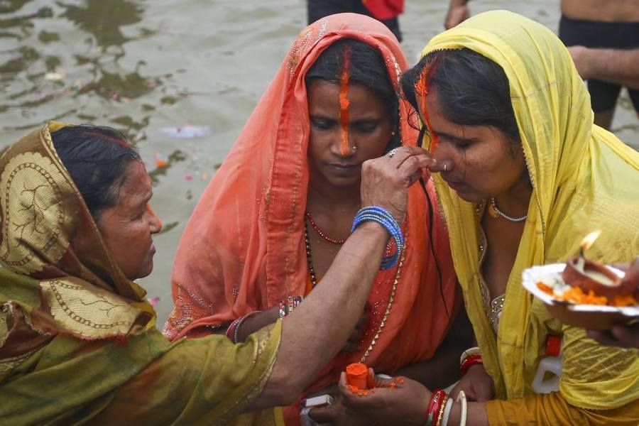 Devotees take a holy dip in river Ganga during the ongoing Maha Kumbh Mela festival at Sangam, in Prayagraj, Thursday, Feb. 20, 2025.