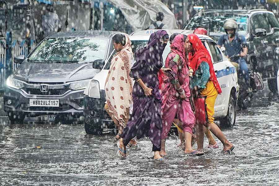 The sudden rain sent commuters without umbrellas scurrying for cover even as they negotiated waterlogged stretches and traffic in the central business district