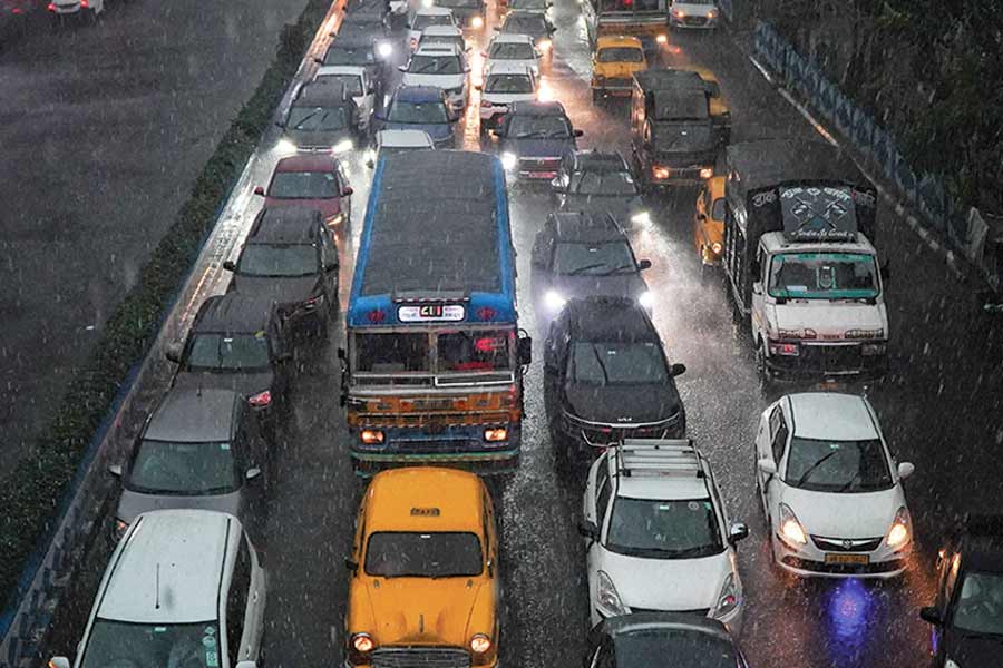 Headlights came on as the midday traffic stood bumper to bumper at various traffic signals across the city