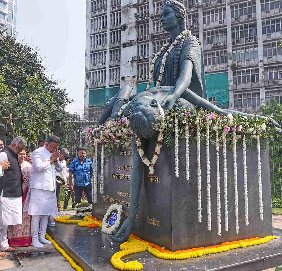 Mayor Firhad Hakim, along with other dignitaries, places flower wreaths at the Language Martyrs’ Memorial at Ekushe Udyan