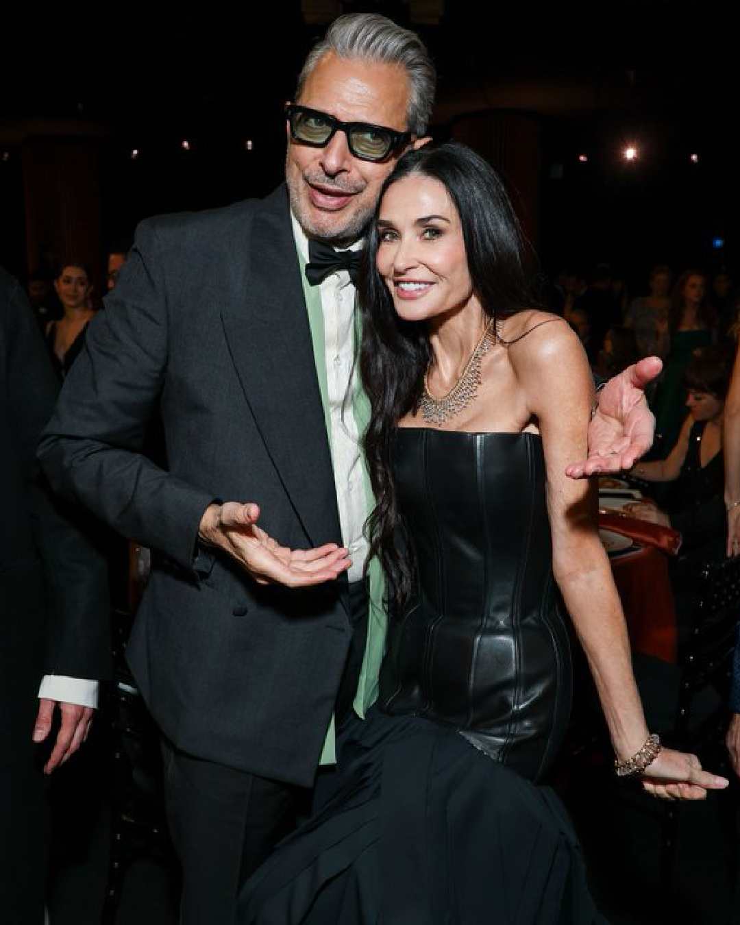 Wicked actor Jeff Goldblum, looking dapper in a black blazer and trousers, caught up with The Substance actress Demi Moore, sporting a corset-fit black gown.  