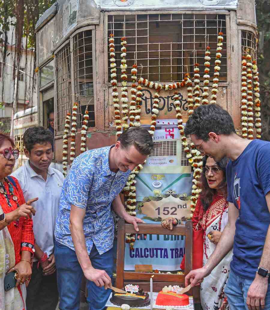 Foreign tourists joined the cake-cutting ceremony to celebrate the 152nd anniversary of Kolkata tram services at Shyambazar on Monday