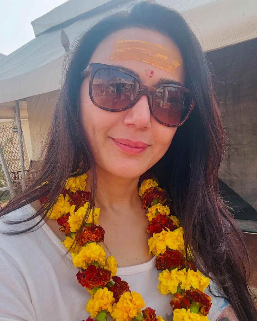 Dressed in a white T-shirt and stylish shades, Preity Zinta shared a selfie from the Mahakumbh Mela.  