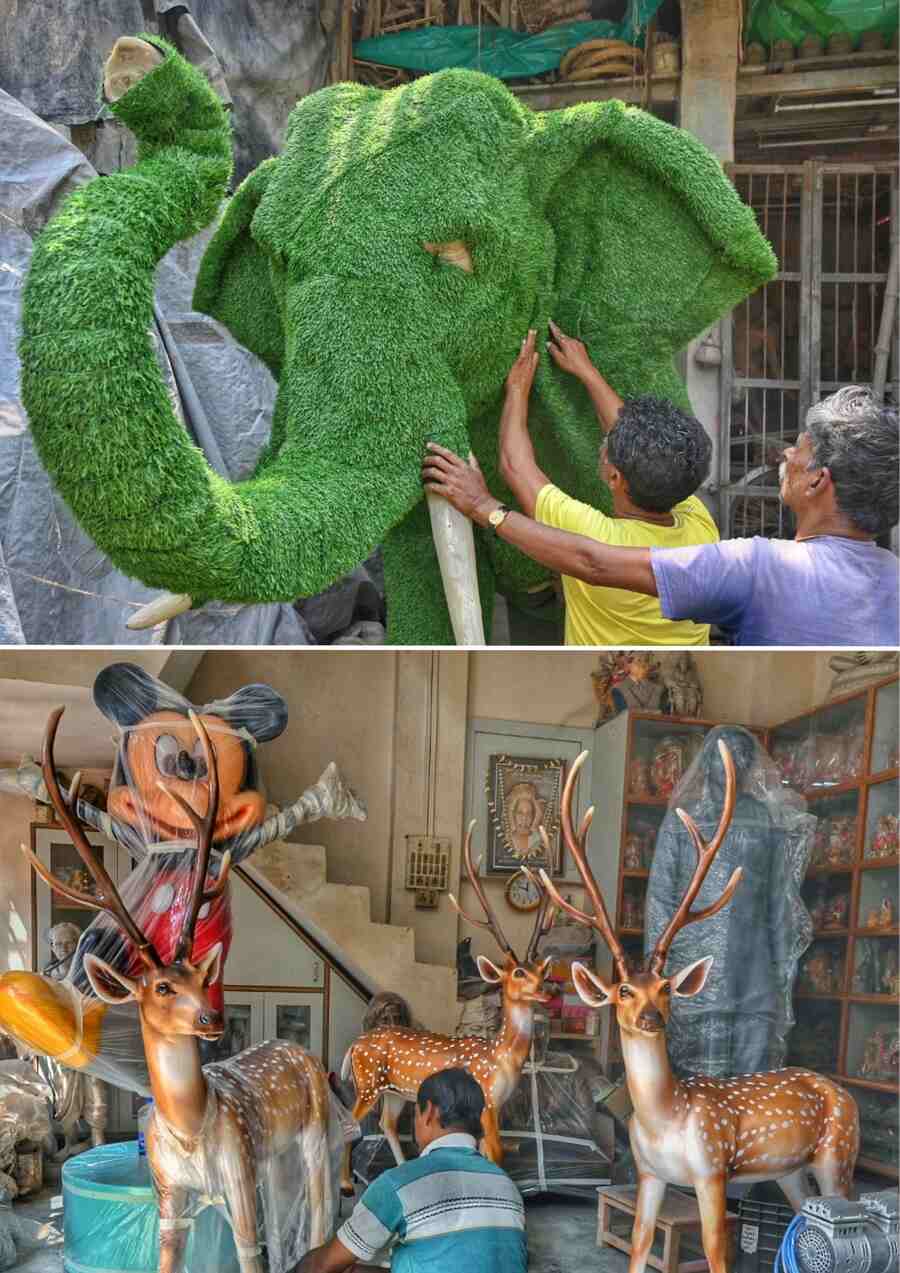 An artisan works on models of elephant, deer and other props at Kumartuli on Friday  
