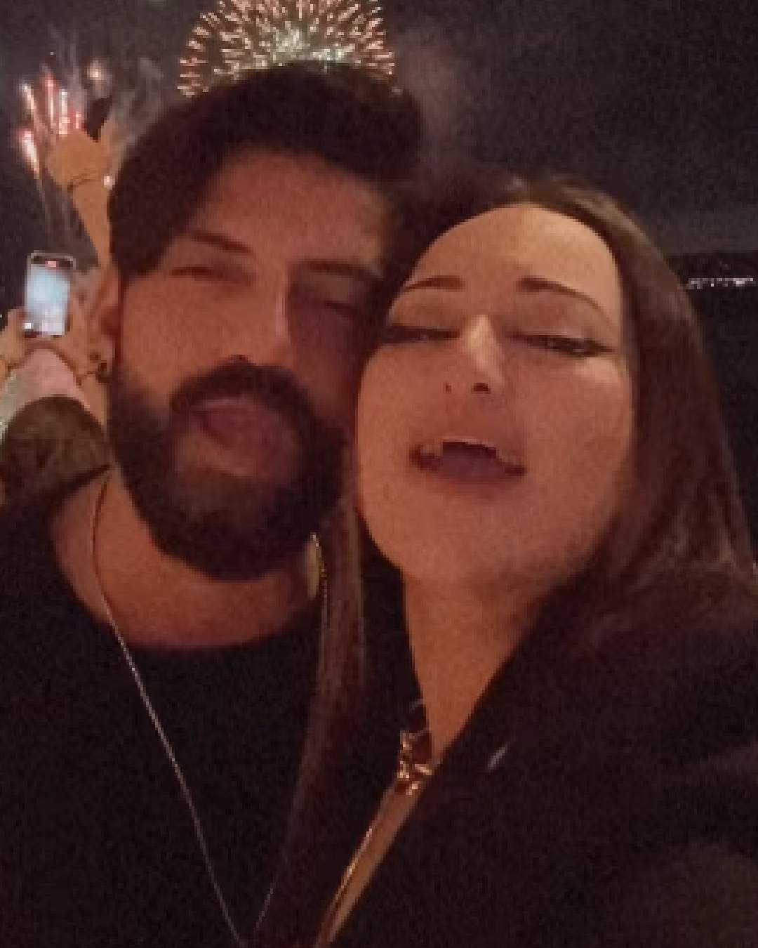 Actor couple Sonakshi Sinha and Zaheer Iqbal twinned in black as they clicked a selfie against the sky lit up with fireworks. They are currently on a holiday in Australia.  