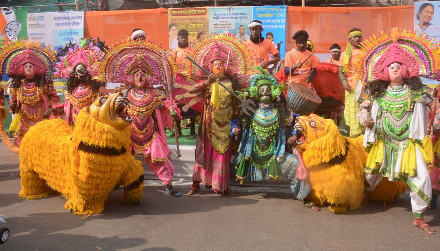 A troupe of Chhau dancers from Jangal Mahal perform in north Kolkata's Nimtala on Wednesday