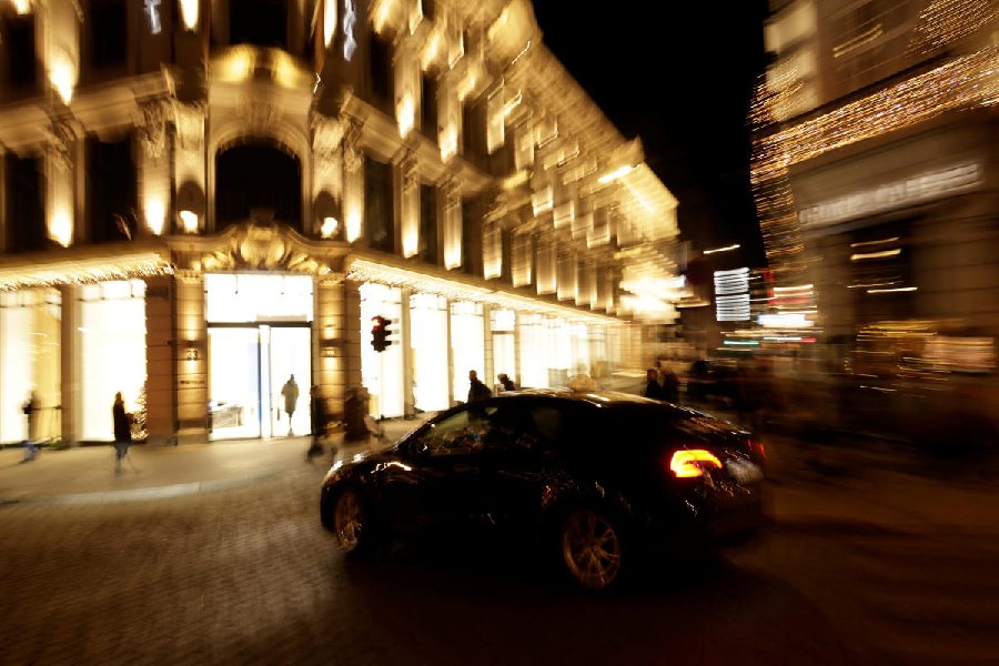 An electric car zooms past the showroom of Chinese E e-carmaker NIO Inc. in Oslo, Norway, December 11, 2024. Reuters