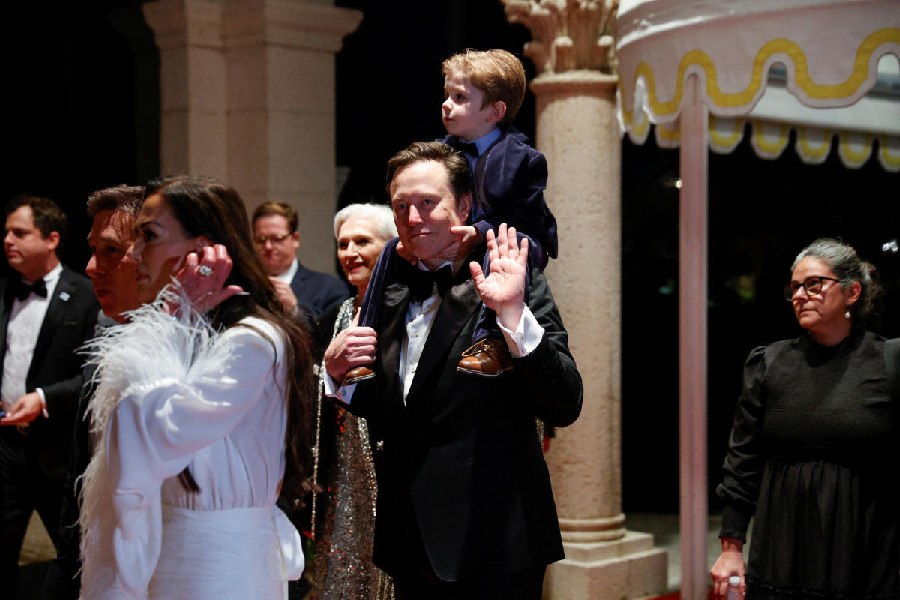 Elon Musk with his at a New Year's Eve event held by U.S. President-elect Donald Trump at Mar-a-Lago in Palm Beach, Florida, U.S., December 31, 2024.