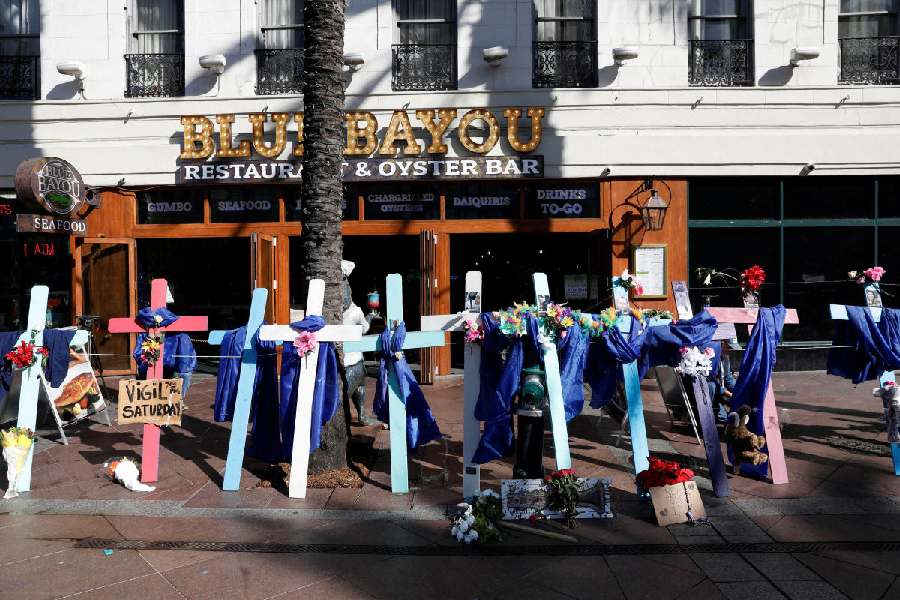At a makeshift memorial, wooden crosses bear the photos of the victims killed in the truck attack on New Year's Day, in New Orleans, Louisiana, U.S. January 3, 2025. 