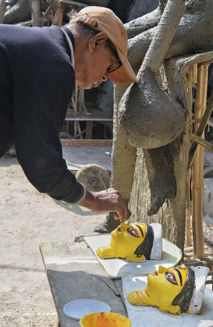 An artist paints the faces of Saraswati idols at Kumartuli on Monday. Saraswati Puja will be observed on February 2  