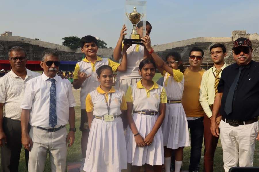 The winner of the junior section, Yellow House, with the champions trophy