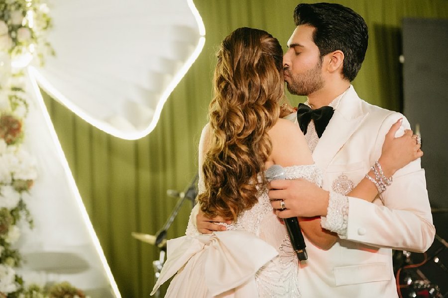Armaan planted a kiss on the bride’s cheek.  