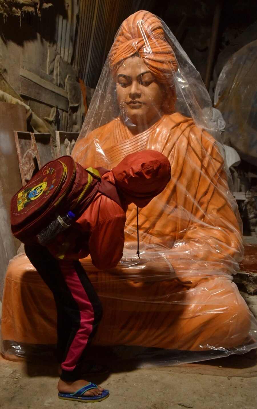 On the eve of Swami Vivekananda’s 162nd birth anniversary, a little boy is attracted by the charisma of the spiritual master’s statue wrapped in polythene 