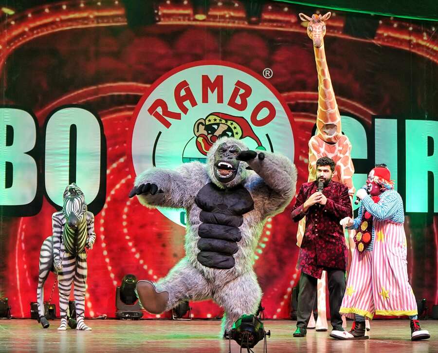 You may have seen Babu the chimpanzee at Alipore zoo, but at Rambo Circus it’s Bonny the gorilla who comes on stage thumping his chest. Accompanying him are a giraffe and a zebra. With animals banned from circuses, Rambo Circus has included a few faux animals to entertain children. The ‘animal’ act comes with a message from emcee Samir for the audience to be kind to animals. Also seen on the stage with them is veteran clown Biju Pushkaran