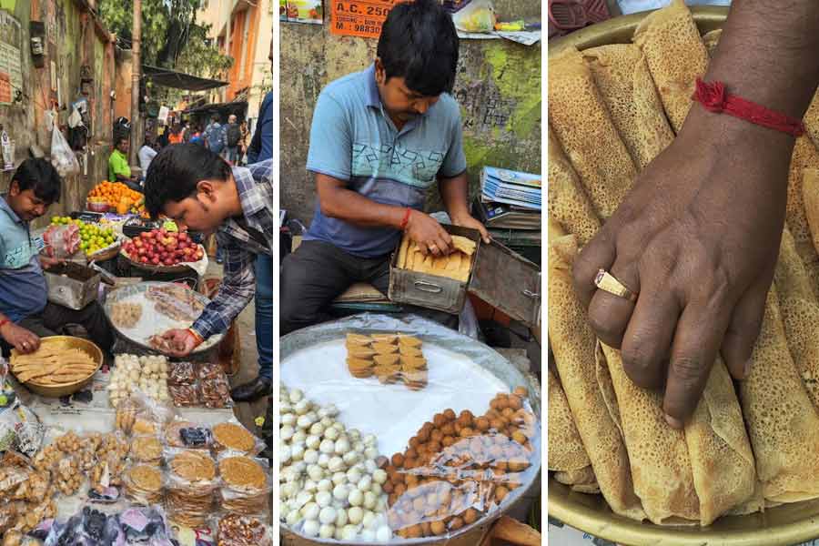 Subrata Haldar from Joynagar in South 24-Parganas district sits outside Dum Dum station with homemade ‘tilkuts’, ‘kadma’, ‘patisapta’ and ‘patali gur’ on Makar Sankranti 