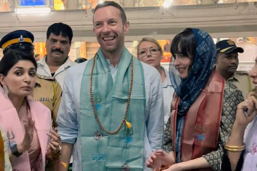 Coldplay lead vocalist Chris Martin visited Babulnath Temple with actress Dakota Johnson in Mumbai on Friday